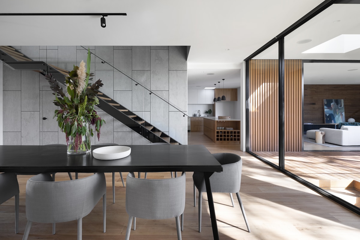 Sculptural architecture with stone, warm timber and soft natural light